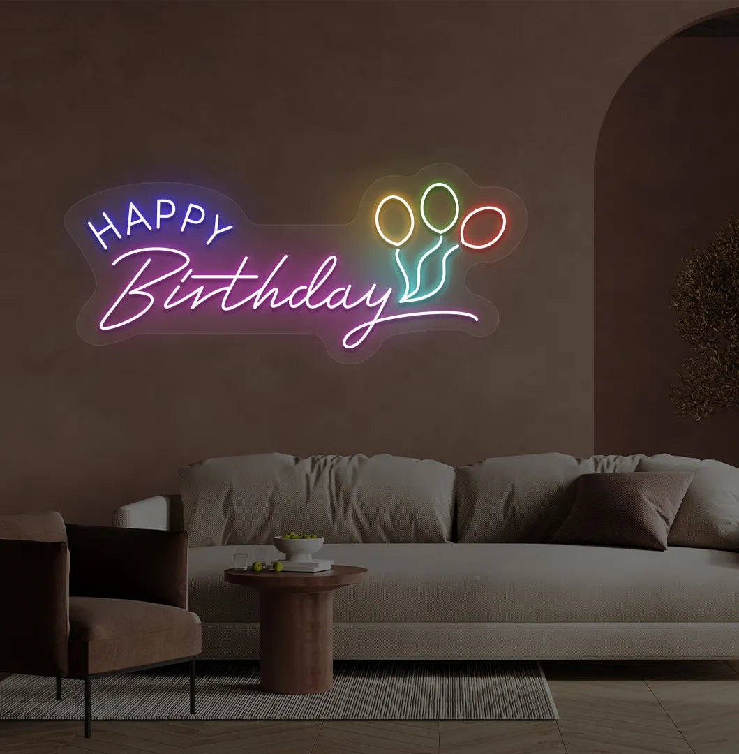 Stylish Happy Birthday LED neon sign glowing purple for celebration backdrop.