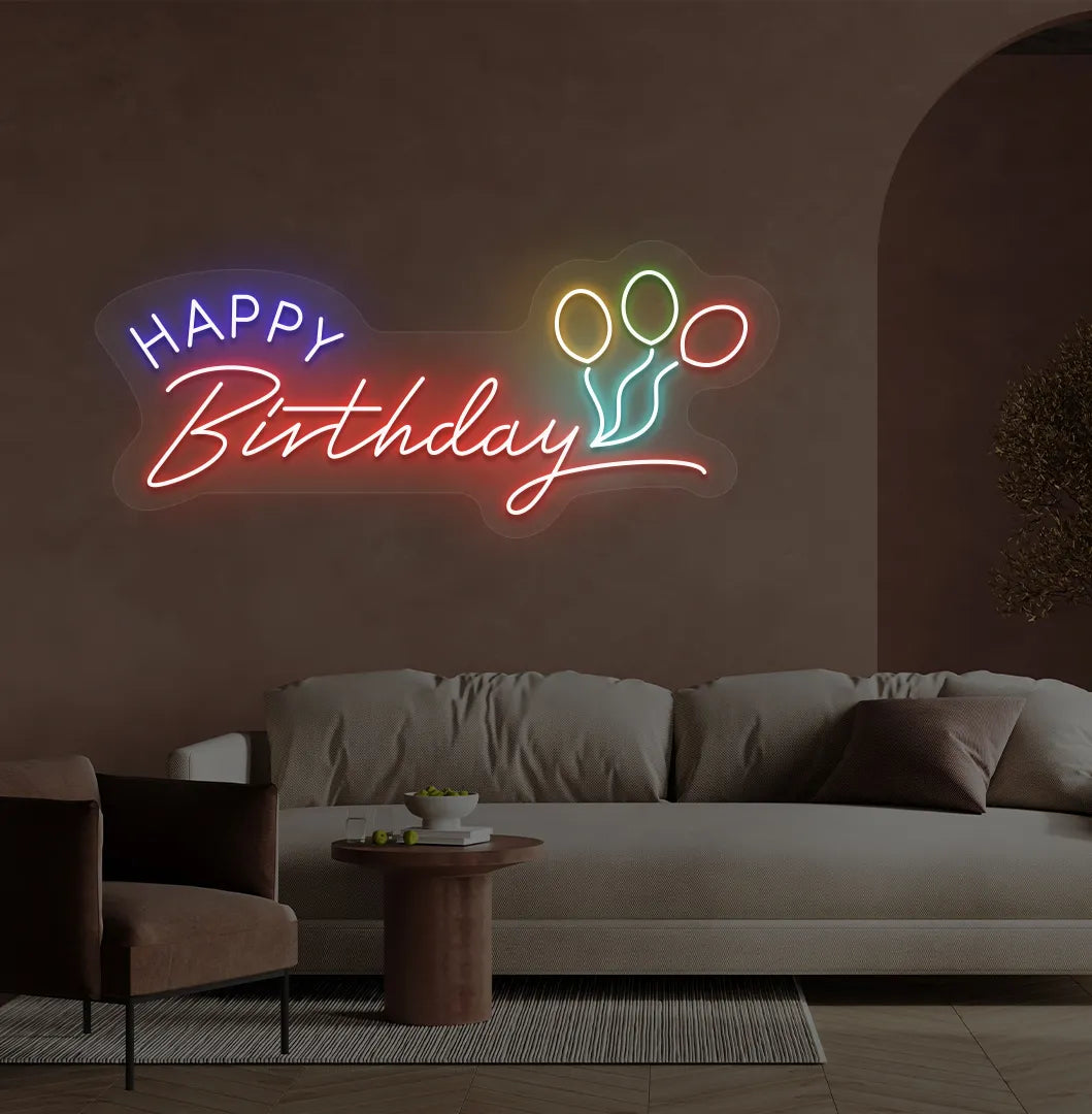 Trendy Happy Birthday neon sign in red mounted on decorative party wall.