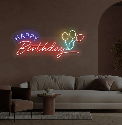 Trendy Happy Birthday neon sign in red mounted on decorative party wall.