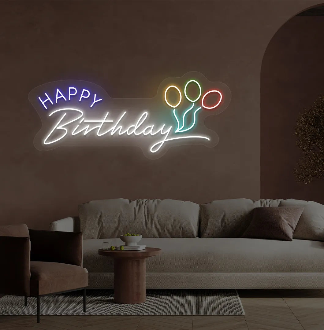 Trendy Happy Birthday neon sign in white mounted on decorative party wall.
