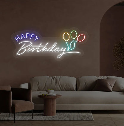 Trendy Happy Birthday neon sign in white mounted on decorative party wall.