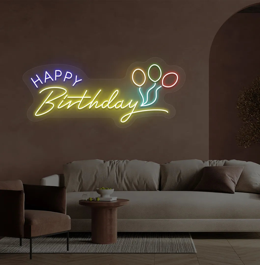 Stylish Happy Birthday LED neon sign glowing yellow for celebration backdrop.
