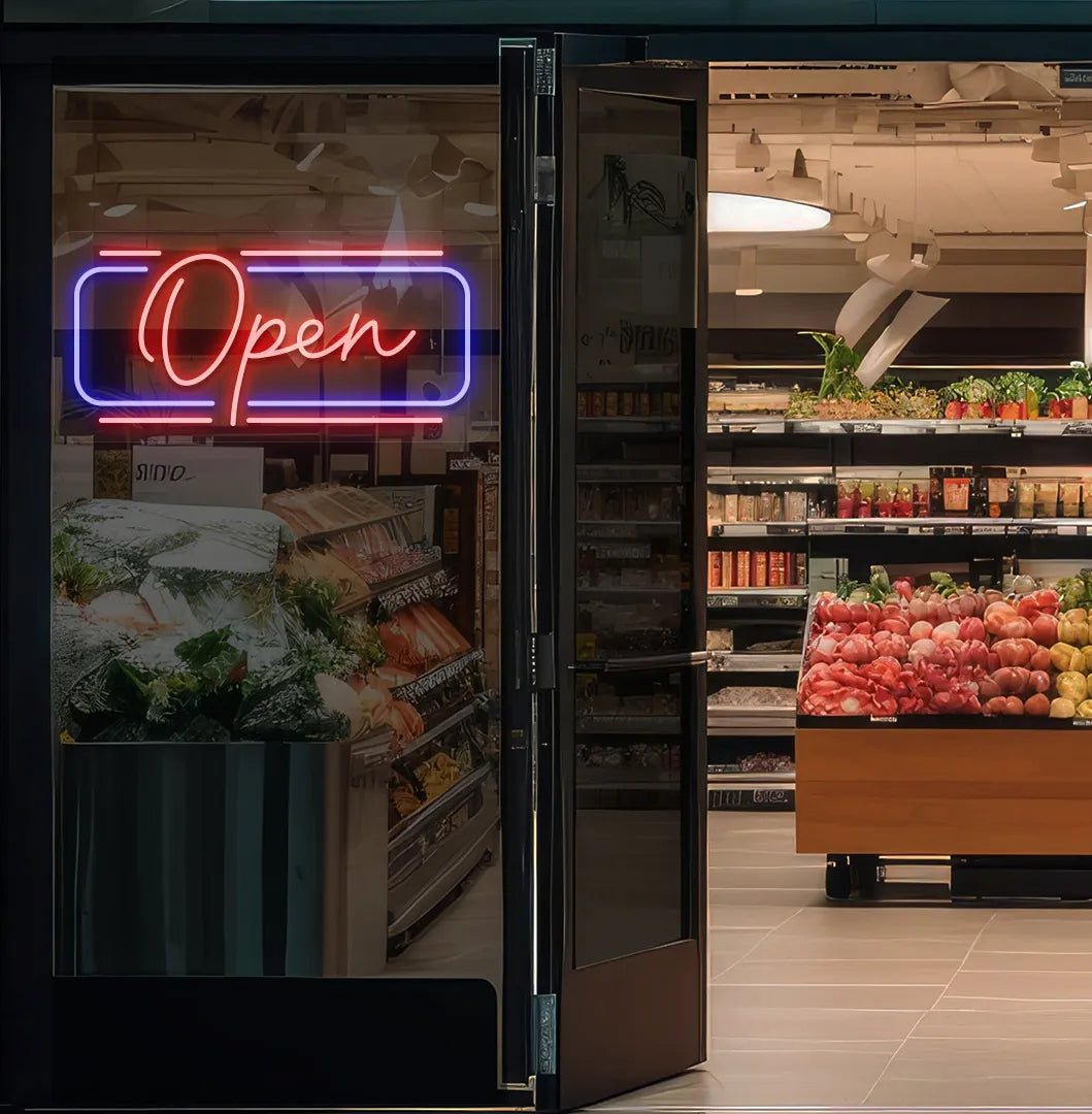 Image of an open LED neon sign glowing on a supermarket glass door in red color.