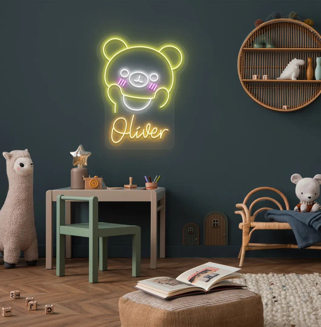 Teddy Bear Nursery Name neon sign glowing orange on decorative wall.