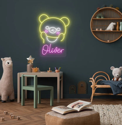 Teddy Bear Nursery Name neon sign glowing purple on decorative wall.