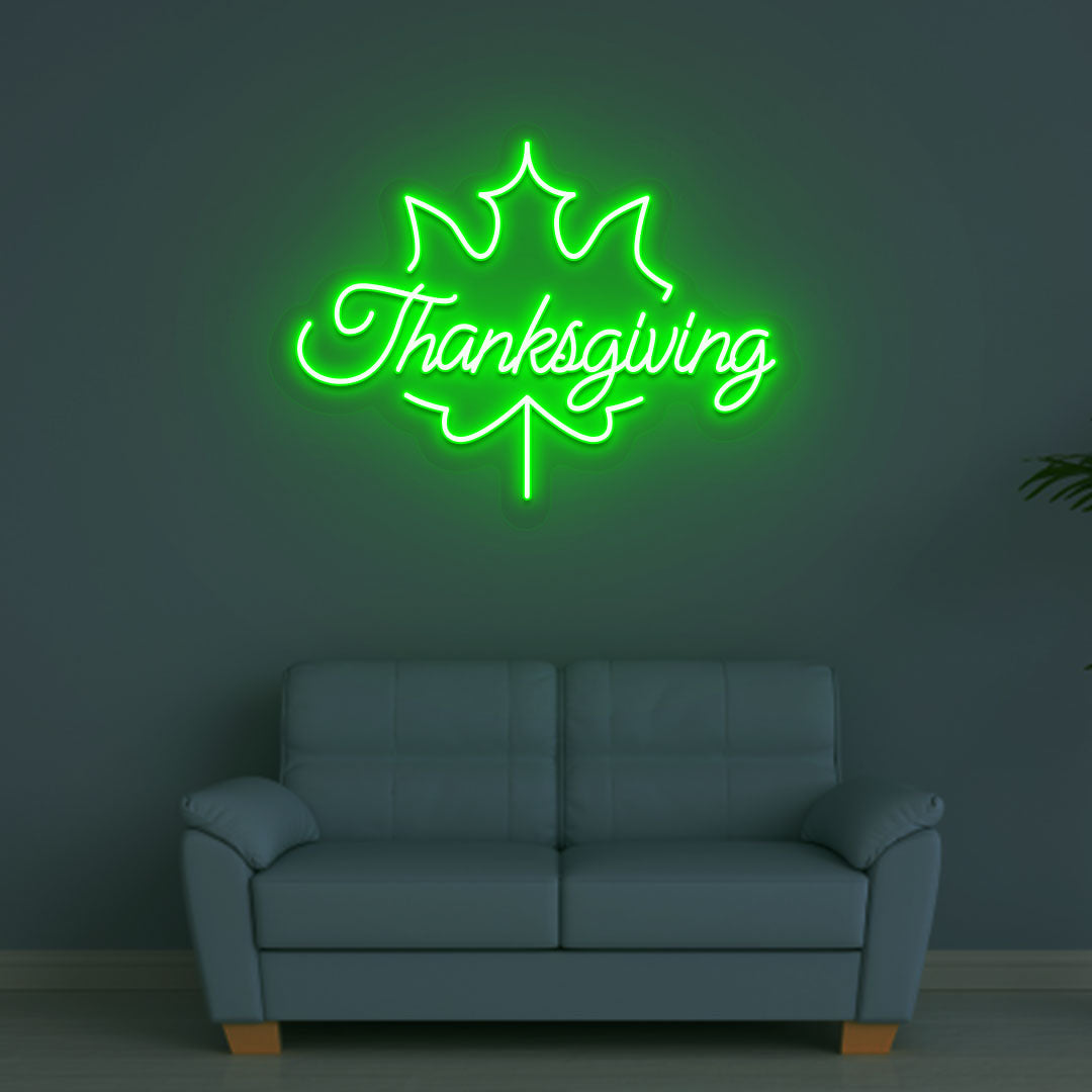 A bright green Thanksgiving neon sign for the holiday hanging on a wall. Perfect for home décor, kitchen walls, and holiday parties.