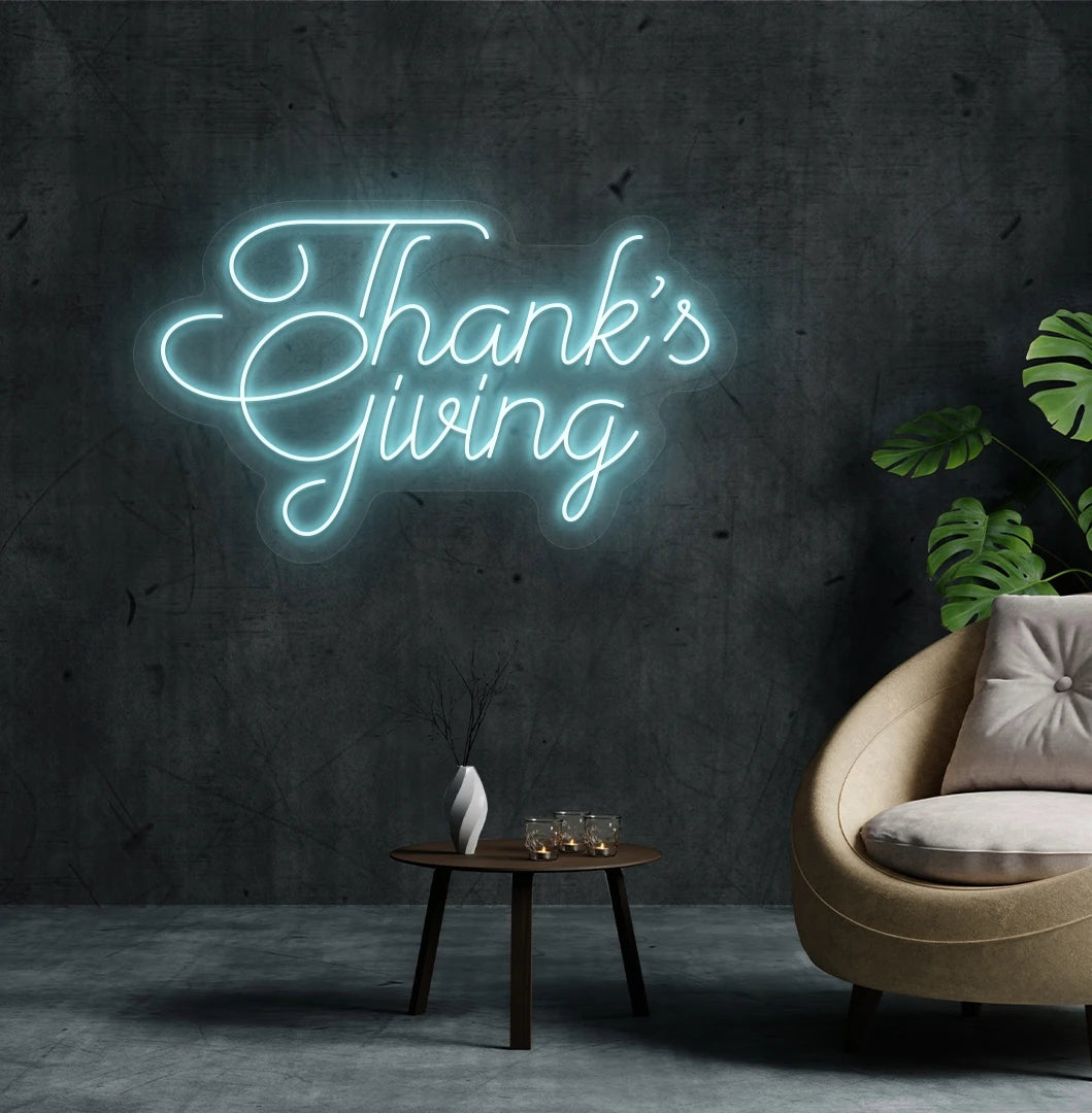 Image of a Thanksgiving neon sign mounted on an aesthetic living room wall in ice blue color.