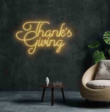 Festive thanksgiving neon sign in orange mounted on living room wall.
