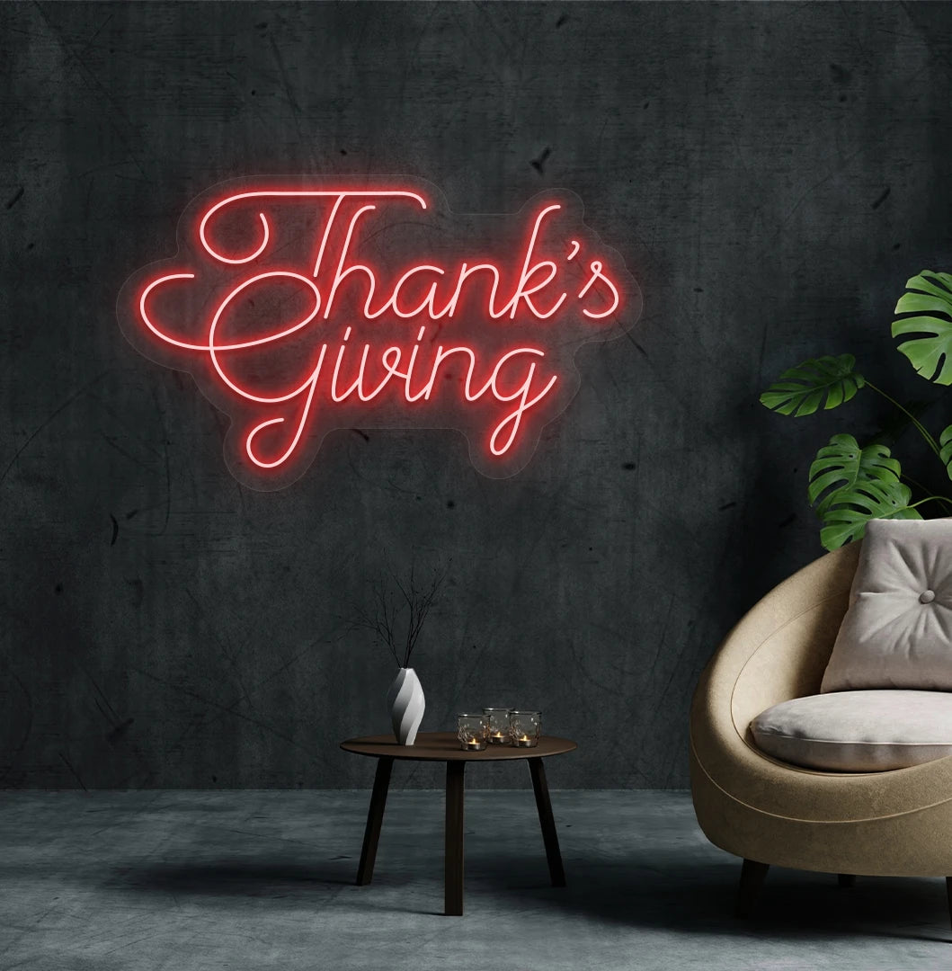 Image of a Thanksgiving neon sign mounted on an aesthetic living room wall in red color.