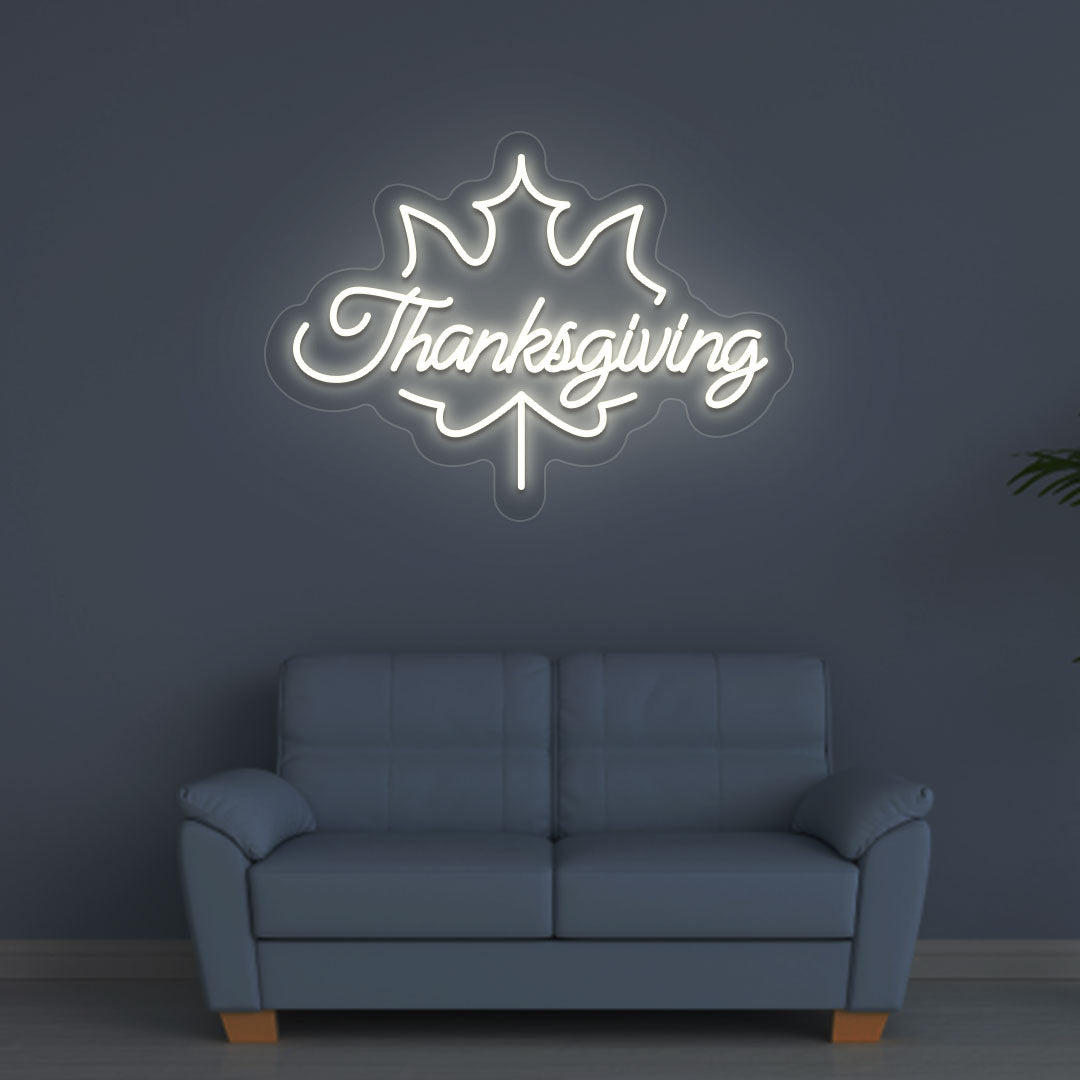 An image of a Thanksgiving neon sign in warm white is displayed on a wall, suitable for home decor and various environments.