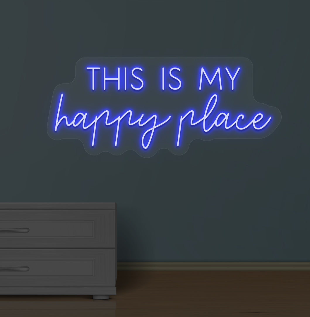 Image of a "this is my happy place" LED neon sign glowing on a wall in blue color.