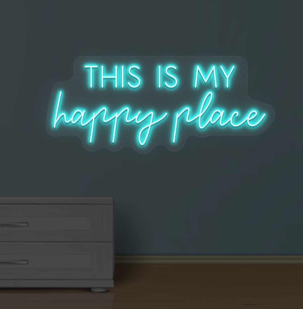 Image of a "this is my happy place" LED neon sign glowing on a wall in ice blue color.