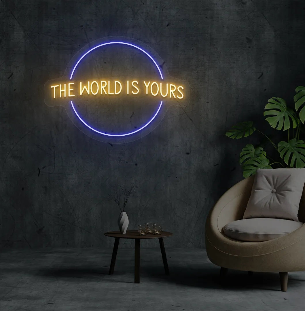 Image of a stylish This World Is Yours neon sign mounted on aesthetic room wall in orange color.