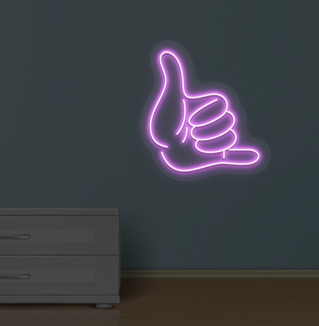 Modern wall with a thumbs-up LED neon sign glowing purple.