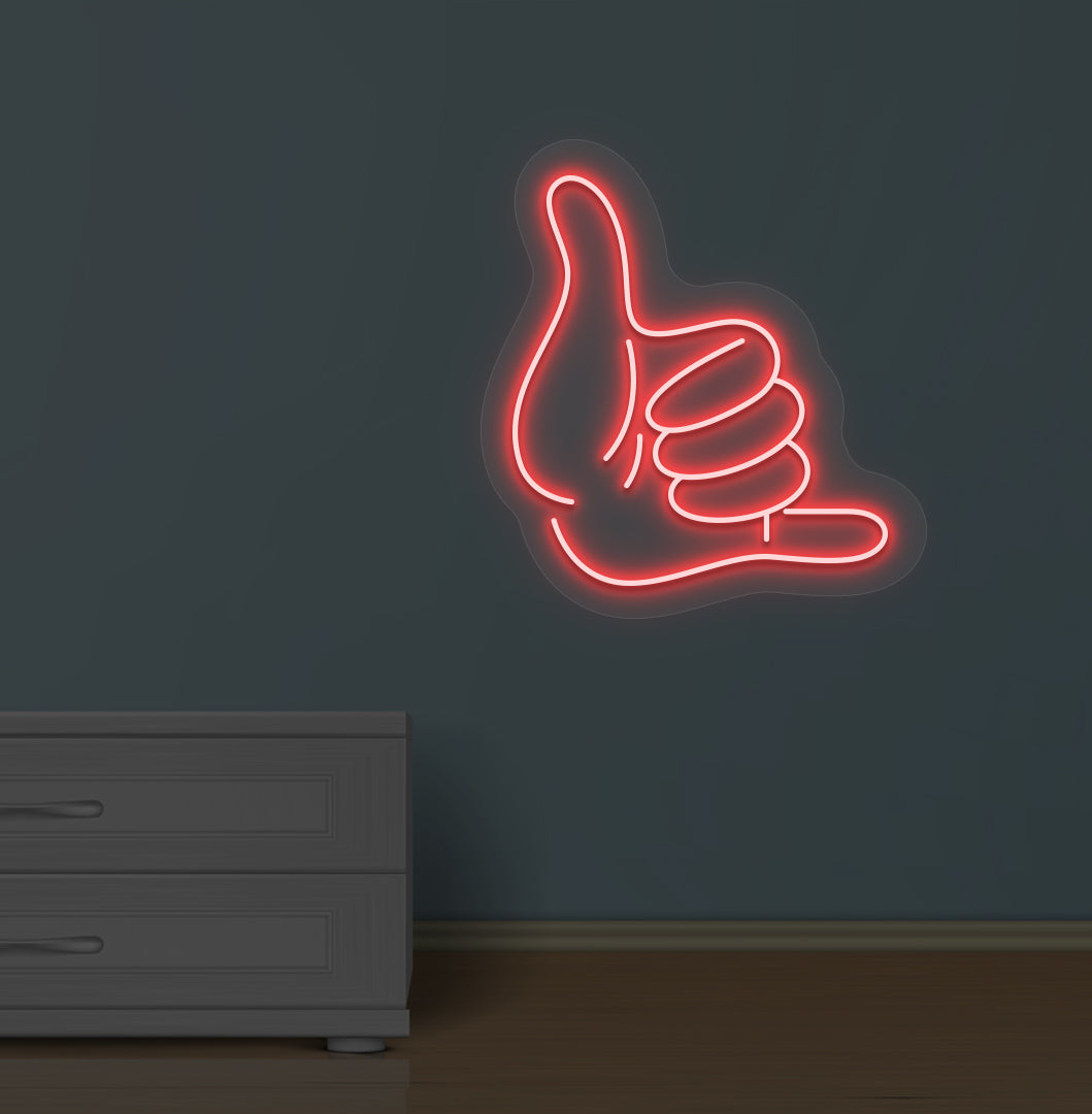 Image of a thumbs-up LED neon sign glowing on a wall in red color.