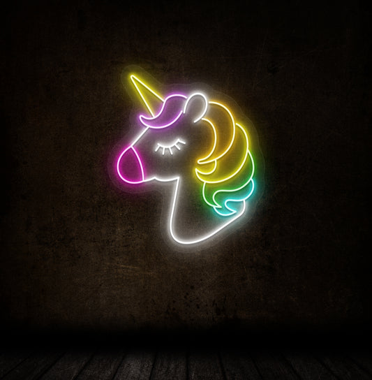 Image of a cute unicorn LED neon sign mounted on a dark wall in multicolor.