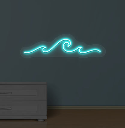 Image of an ocean-style wave neon sign glowing ice blue on a wall.