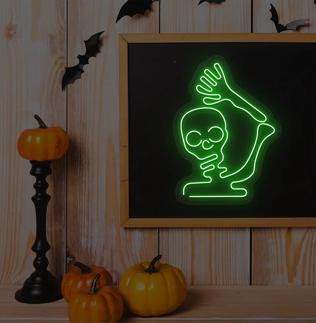 Waving Skeleton Green Neon Sign creating a spooky glow on a Halloween themed wall.