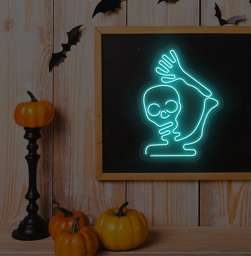 Ice Blue Waving Skeleton Neon Sign glowing on a spooky Halloween themed wall.