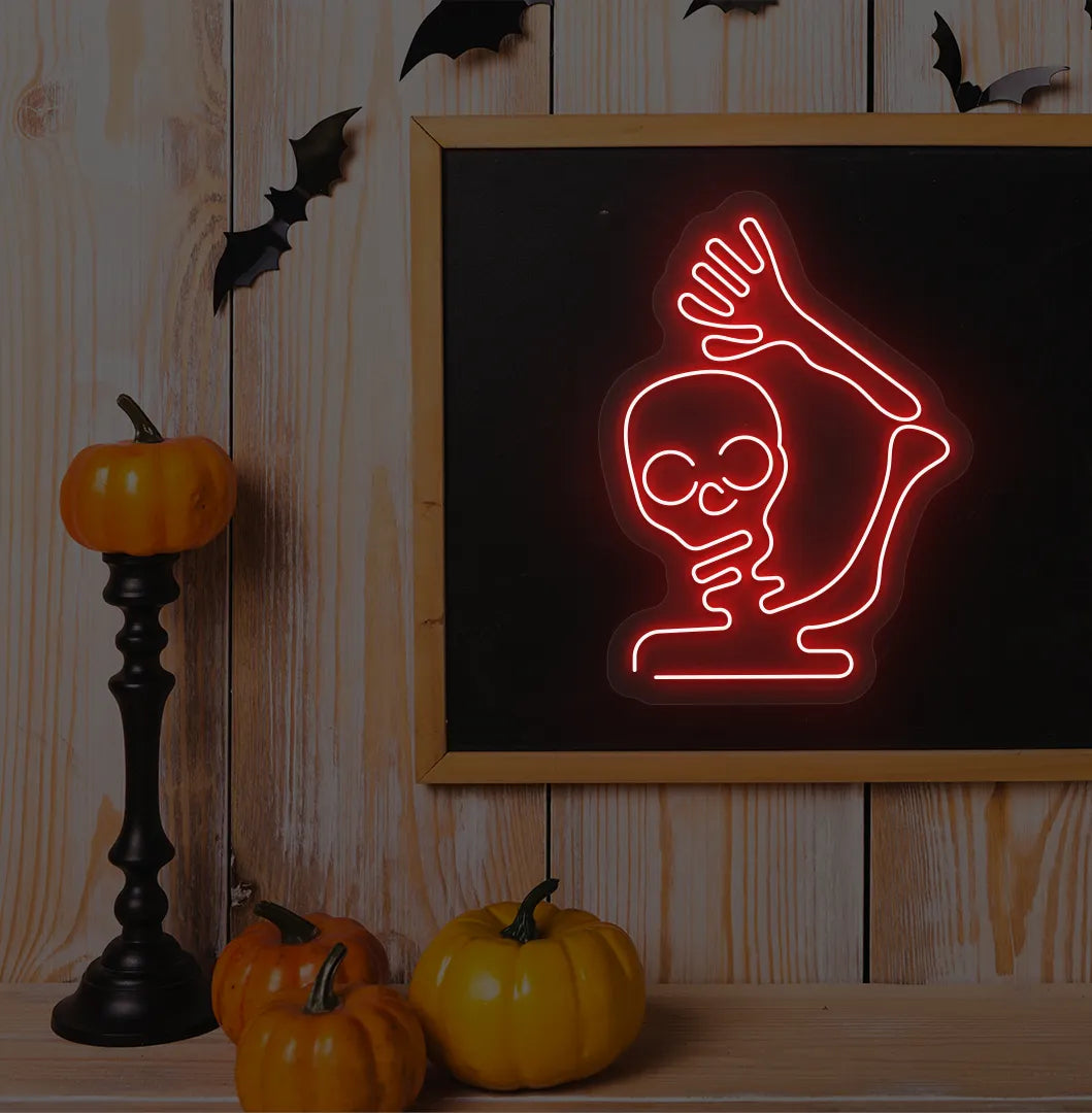 Red Waving Skeleton Neon Sign glowing on a spooky Halloween themed wall.