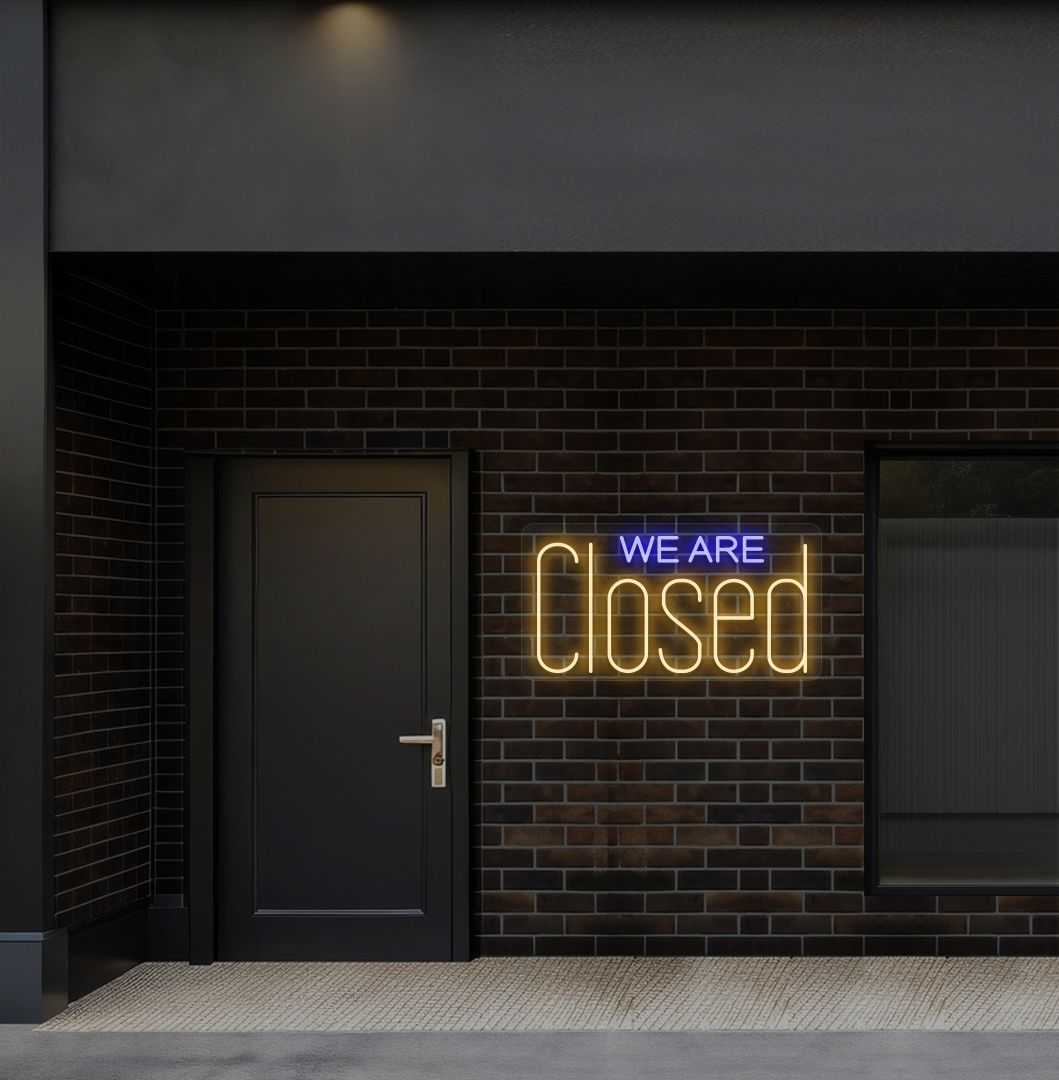 Bright orange LED we are closed neon sign perfect for shop exterior decor.
