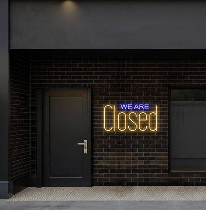Bright orange LED we are closed neon sign perfect for shop exterior decor.