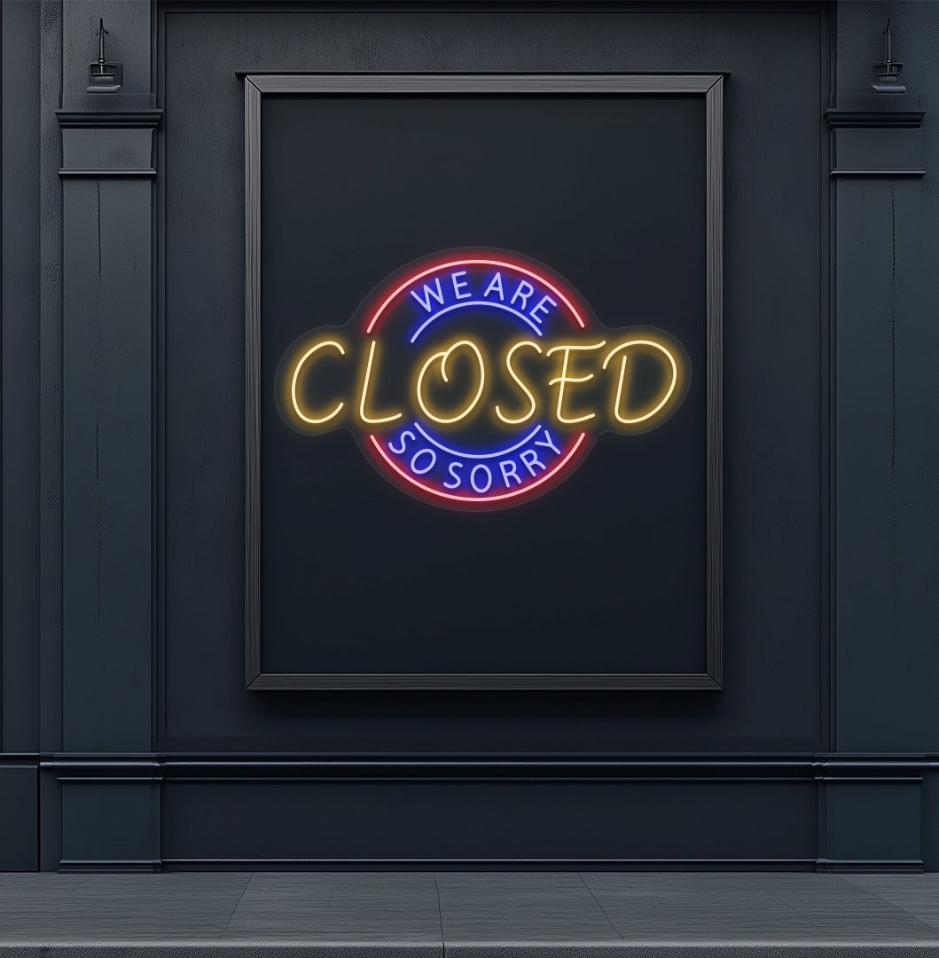 Stylish orange LED we are closed so sorry neon sign mounted on wall. 
