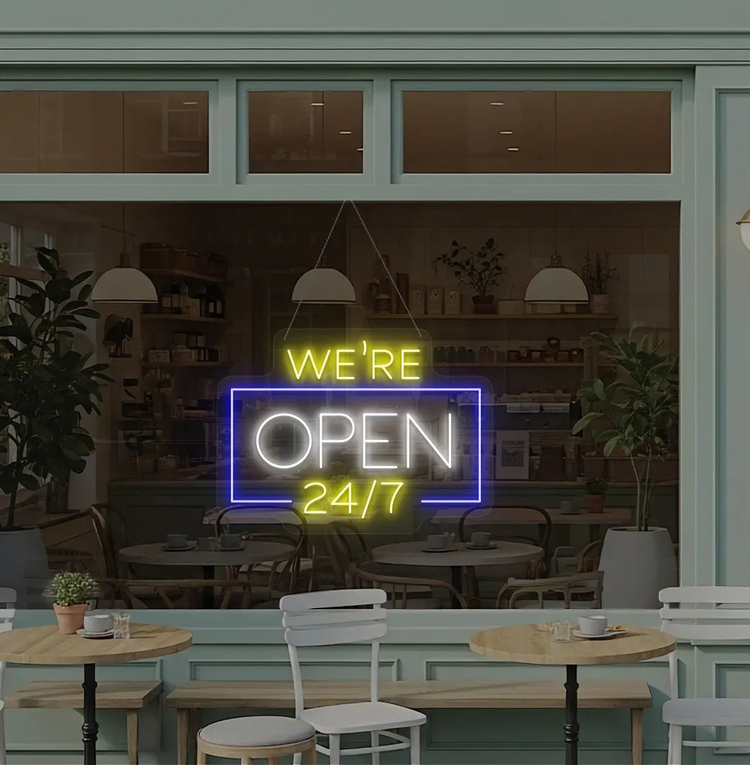 Stylish We Are Open 24/7 neon sign mounted on coffee shop glass door in white color.