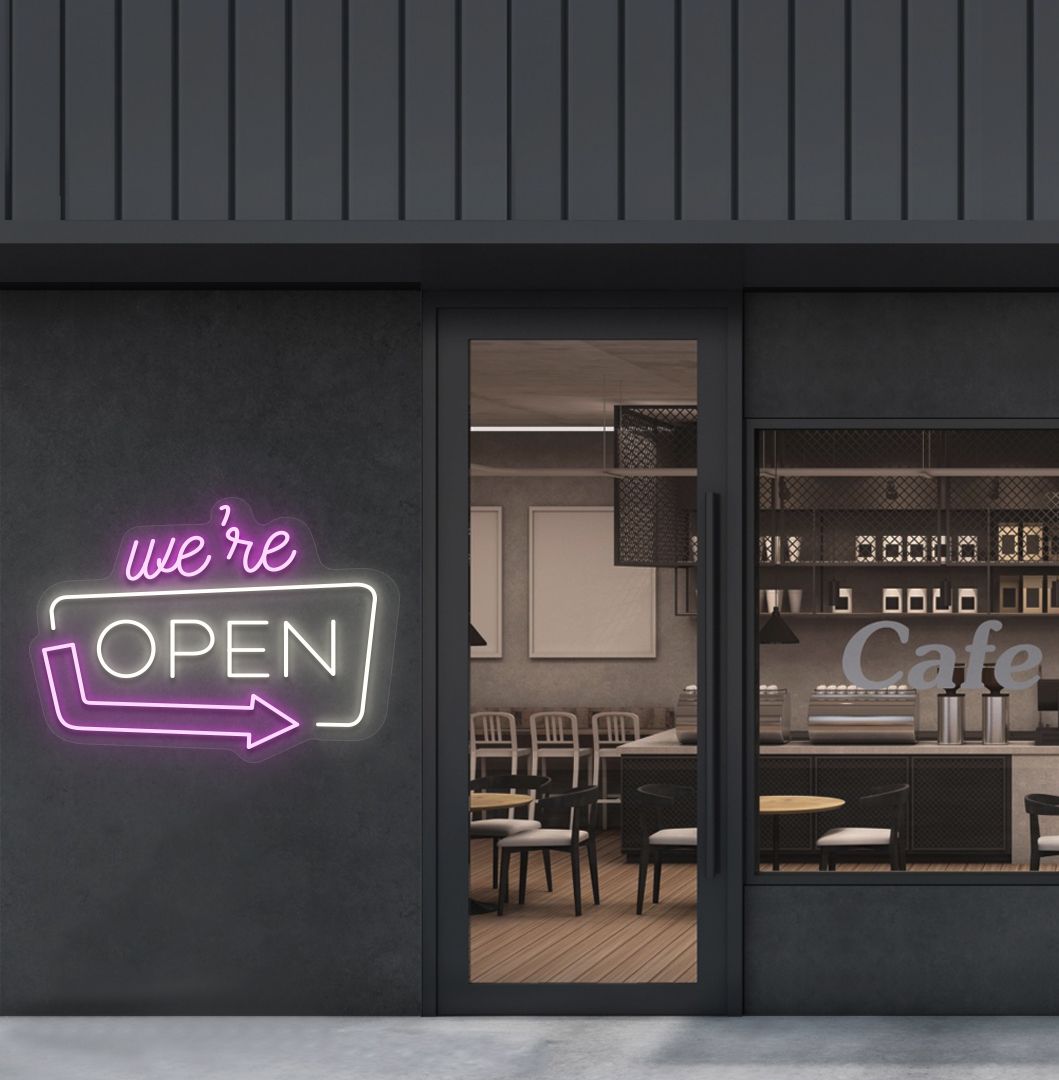 Cafe outdoor wall with a "We're Open" arrow neon sign glowing warm white. Perfect for café outdoor walls, storefront signage, restaurants, and commercial spaces.