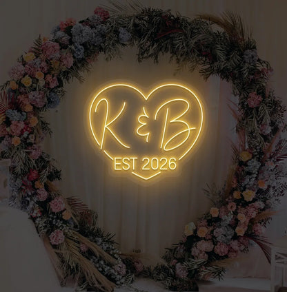 Image of a custom wedding EST neon sign in orange color on aesthetic wall decor.