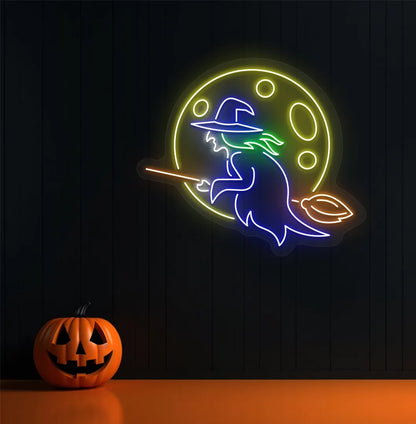 Witch LED neon sign with blue glow mounted on Halloween wall décor.