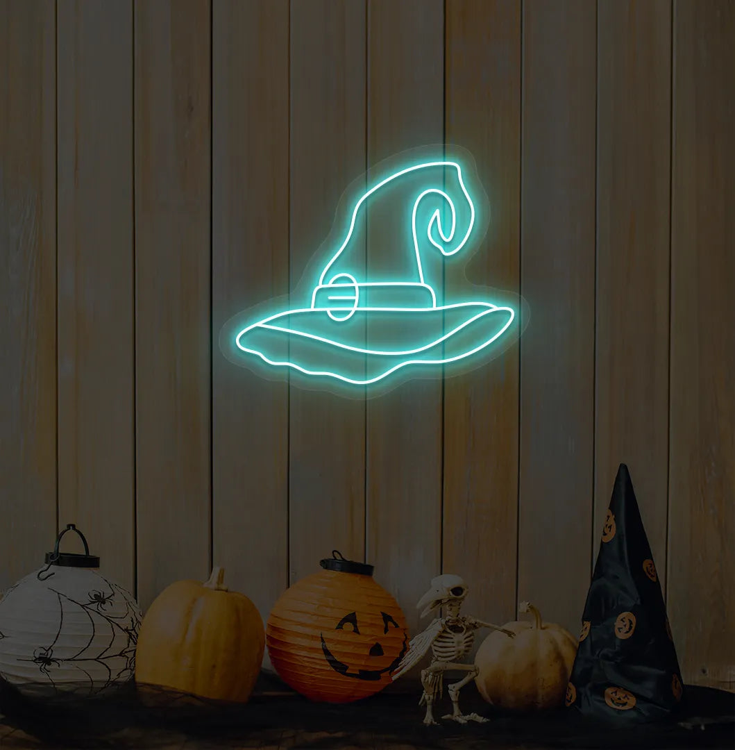 Witch Hat Neon Sign illuminated in ice blue on a spooky Halloween themed wall
