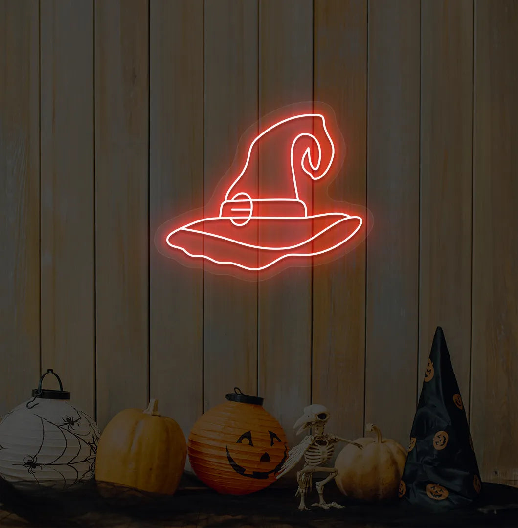 Witch Hat Neon Sign illuminated in red on a spooky Halloween themed wall