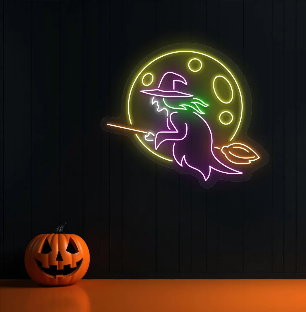 Witch Neon Sign illuminated in purple on a spooky Halloween themed wall.