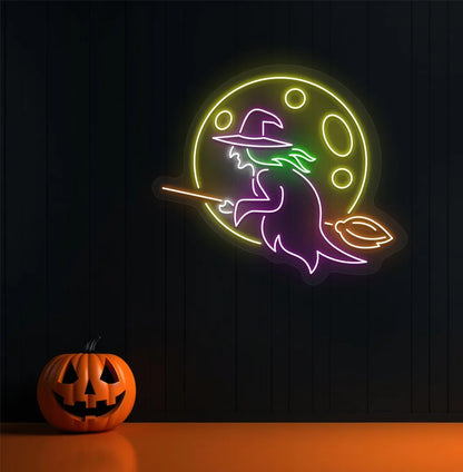 Witch Neon Sign illuminated in purple on a spooky Halloween themed wall.