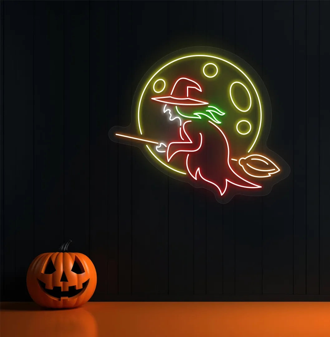 Witch LED neon sign with red glow mounted on Halloween wall décor.