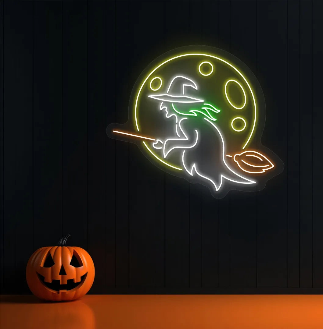 Witch LED neon sign with white glow mounted on Halloween wall décor.
