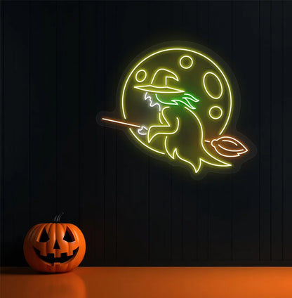 Witch Neon Sign illuminated in yellow on a spooky Halloween themed wall.