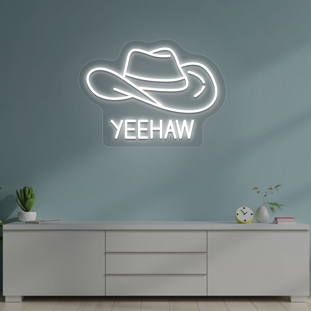 A western-style YEEHAW neon sign glowing white on the wall. Perfect for living rooms, western-themed interiors, parties, and home bars.