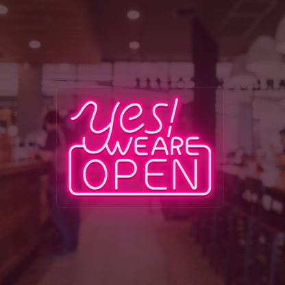 Image of a "Yes, we are open" neon sign glowing on a shop door in pink color.