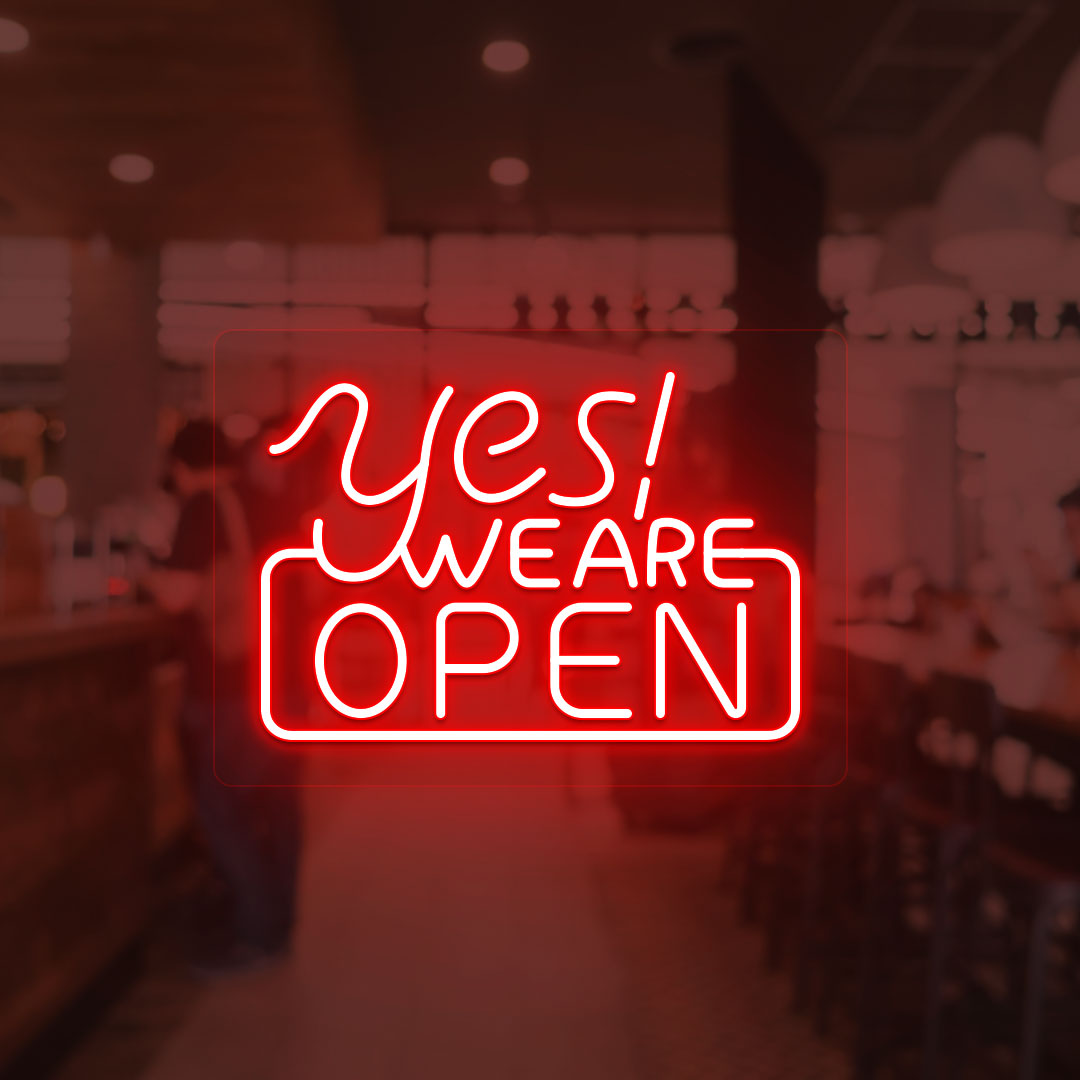 Image of a "Yes, we are open" neon sign glowing on a shop door in red color.