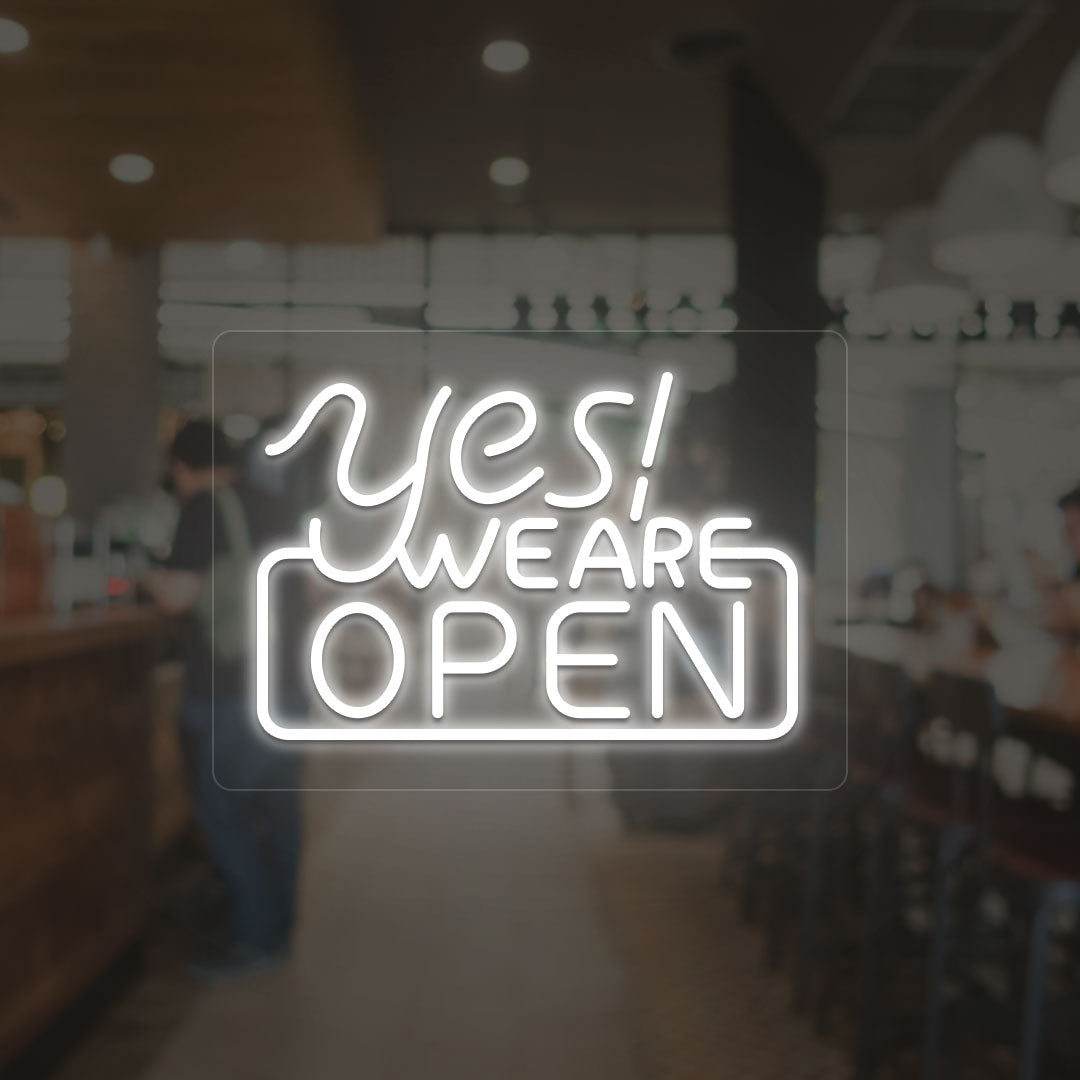 Yes, we are open neon sign in white LED glowing on glass wall entrance. 