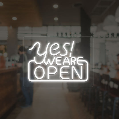 Yes, we are open neon sign in white LED glowing on glass wall entrance. 