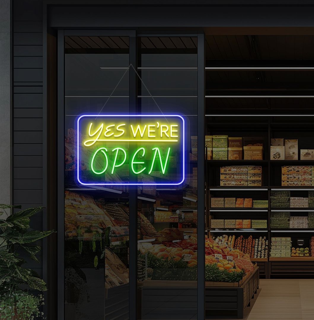Modern, yes, we're open—an LED neon sign glowing green on the cafe door.