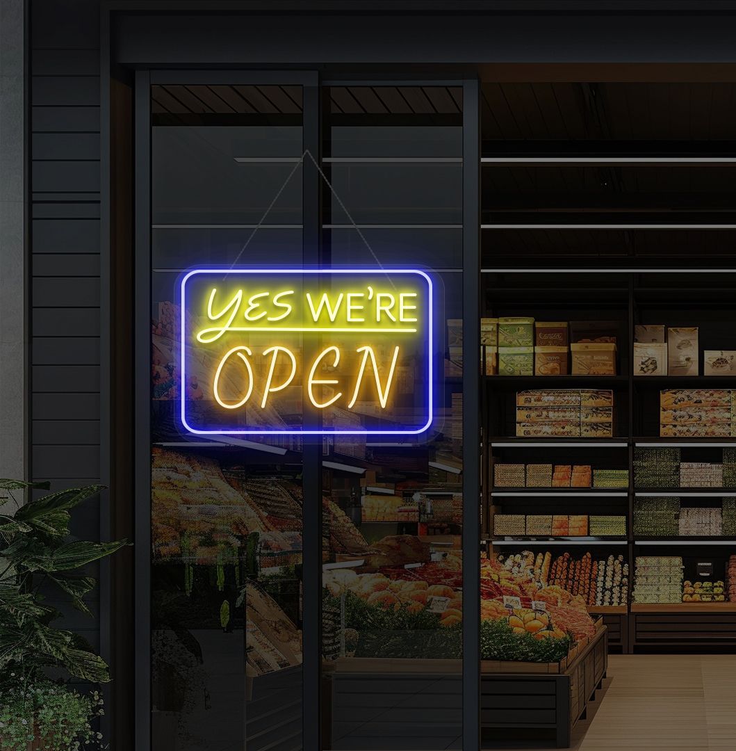 Modern, yes, we're open—an LED neon sign glowing orange on the cafe door.