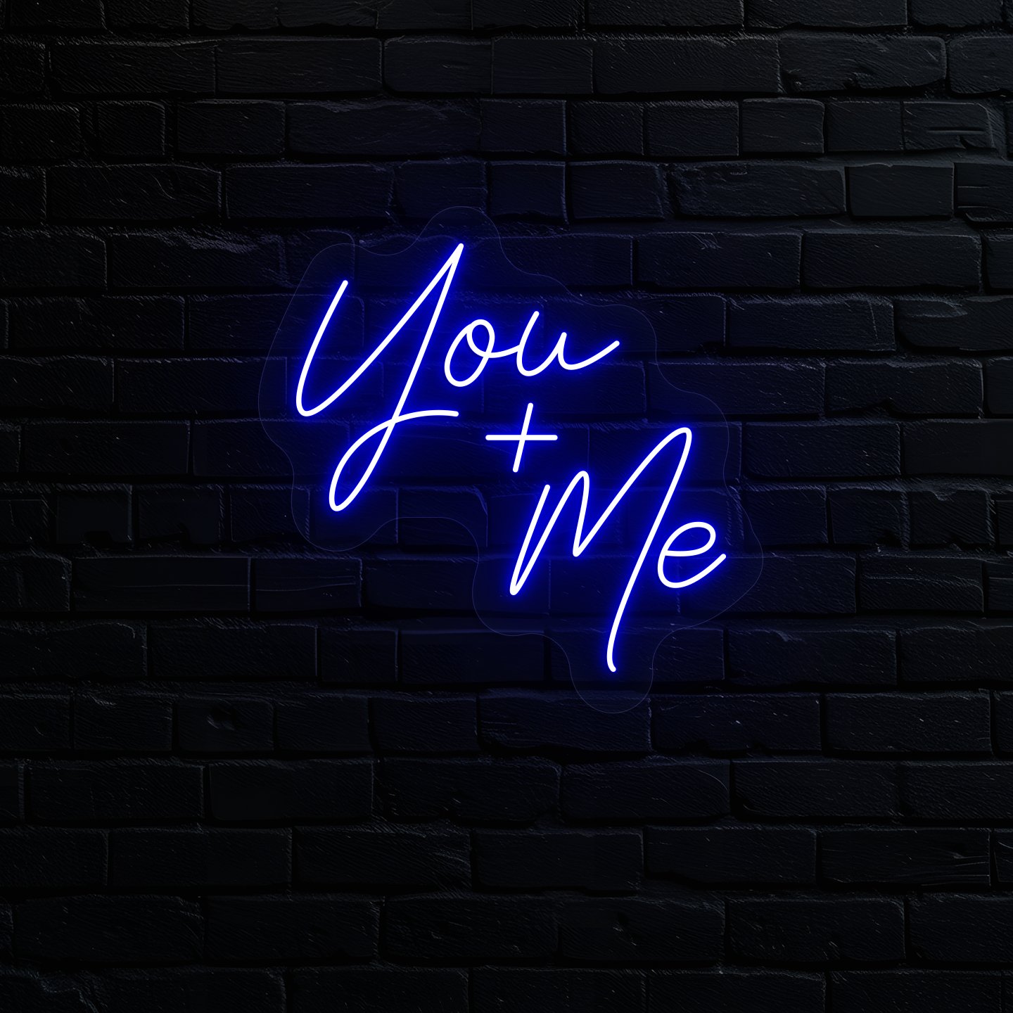 Image of a "you plus me" LED neon sign glowing on wall in blue.