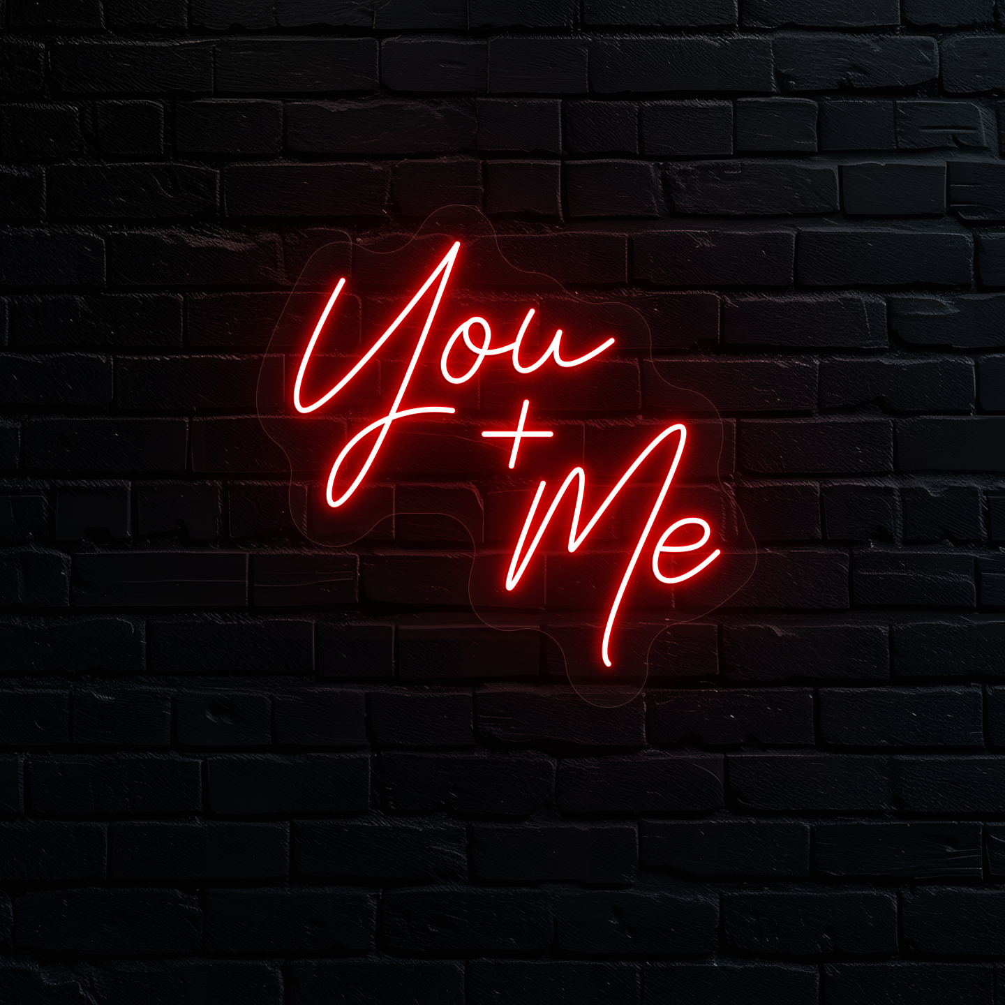 Image of a "you plus me" LED neon sign glowing on wall in red.