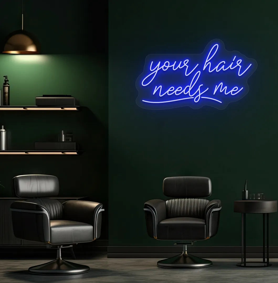 Beauty salon interior with Your Hair Needs Me neon sign glowing blue.
