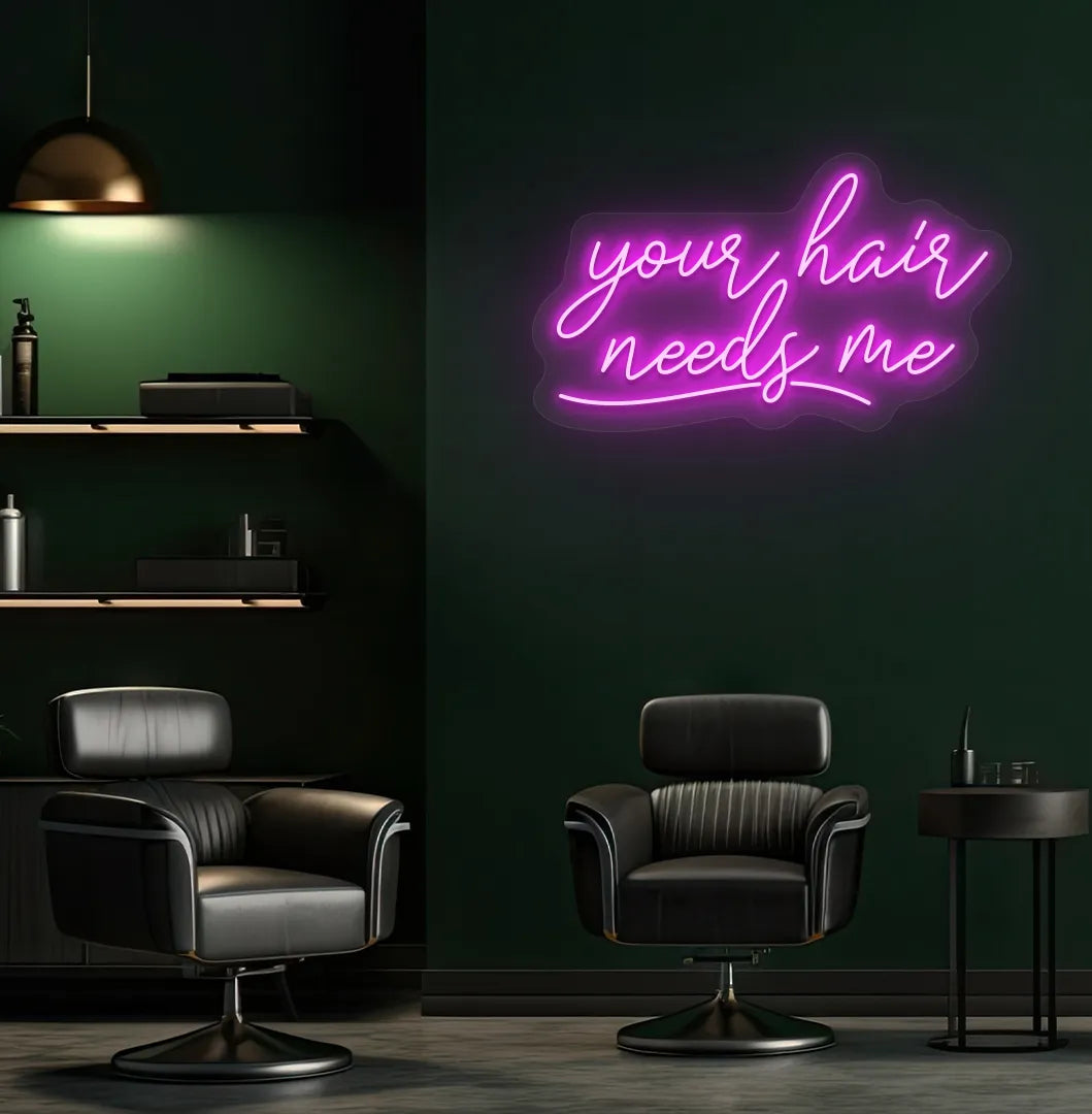 Beauty salon interior with Your Hair Needs Me neon sign glowing pink.